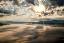 Photo of sun breaking through the clouds