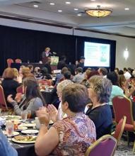 Executive director of the Fair Housing Center of Central Indiana speaks at the conference