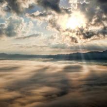 Photo of sun breaking through the clouds