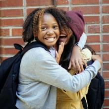 two teens hugging